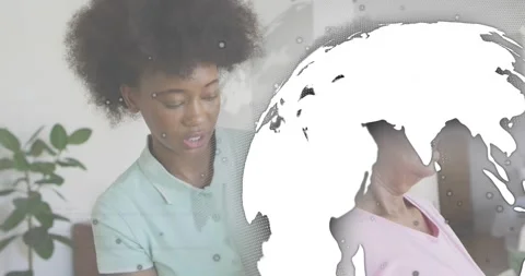 As globe and code overlays drifting, beauty stylist picking client hair with Stock Footage 318626302