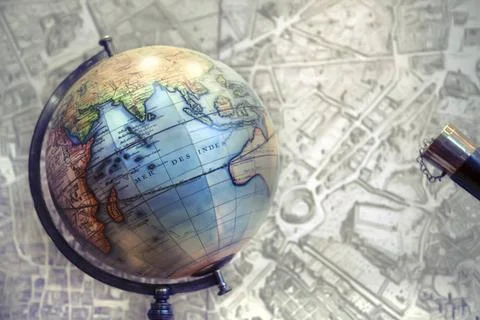 Globe and map globe on old town map background Copyright: xZoonar.com/aria... Stock Photos