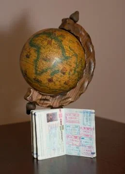 The globe and the passport Stock Photos