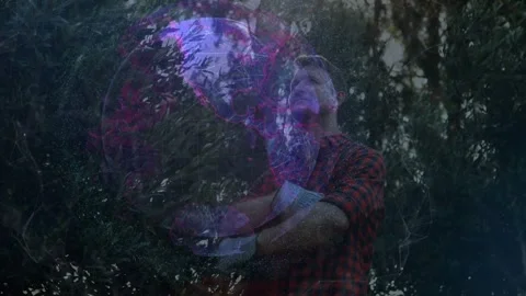 Globe appearing, man holding, gazing upward then folding arms while mapping Stock Footage 333485846