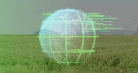 Globe appearing over grass rotating scrolling code turbines rising pulsing grid Stock Footage 317207022