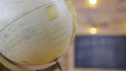 Globe on background of an empty school class with chalkboard, close up. School Stock Footage 161009725