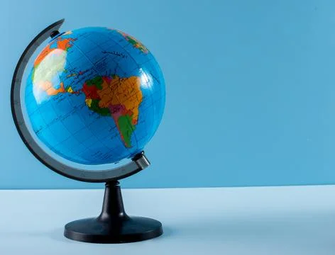 Globe on blue background Stock Photos