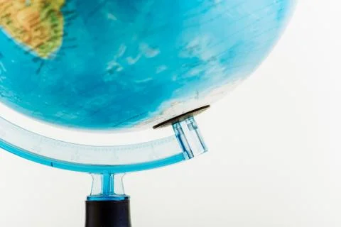 Globe on the bright blurred background, close-up photo. Tourist concept Stock Photos