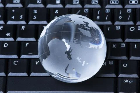 Globe on computer Stock Photos
