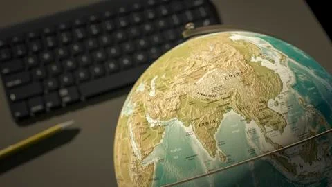 Globe on a desktop shows India Stock Illustration