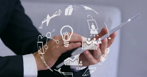 Globe of digital icons against mid section of man using digital tablet Stock Footage 139808439