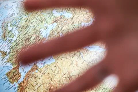 Globe of earth behind hand Stock Photos