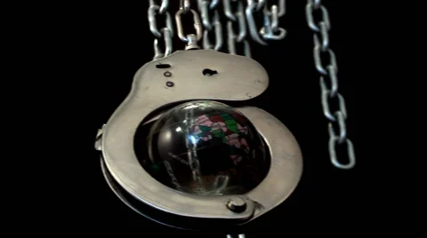 Globe enclosed in handcuffs Stock Footage 43261278