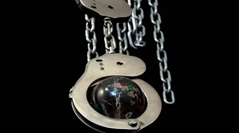 Globe enclosed in handcuffs Stock Footage 43261279