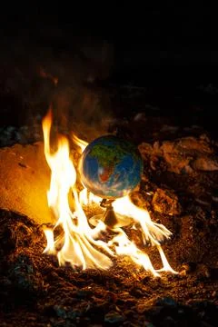 Globe in fire circle in abandoned space. Parallel to 2020 year 库存照片