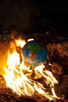 Globe in fire circle in abandoned space. Parallel to 2020 year Fotos Stock