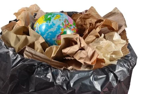 Globe in the garbage bin Stock Photos