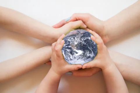 Globe in the hands. Elements of this image furnished by NASA Stock Photos