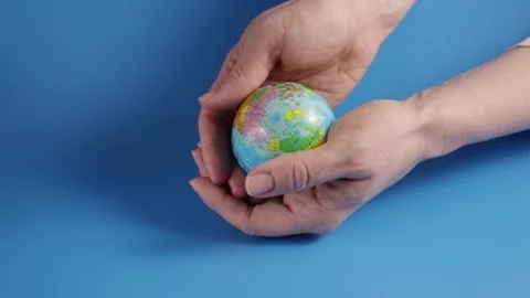 Globe in hands, nature conservation, global responsibility, environmental uni Stock Footage 262947034