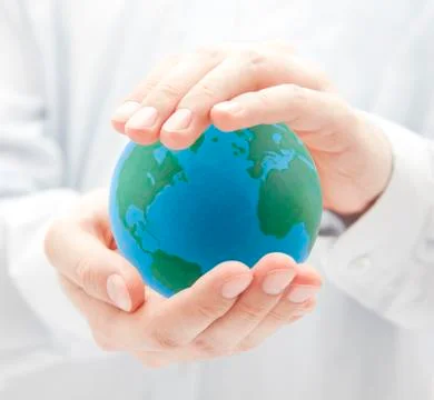 Globe in hands Stock Photos