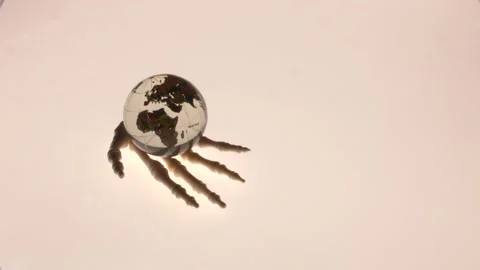 Globe in the hands of the skeleton symbol of the Apocalypse. Stock Footage 136469818