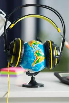 Globe in headphones 写真素材