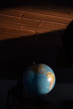 Globe illuminated by the sun Stock Photos