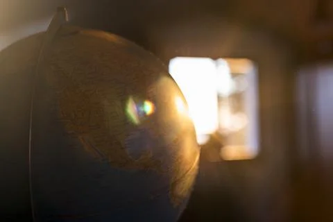 Globe illuminated by the sun Stock Photos