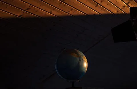 Globe illuminated by the sun Stock Photos