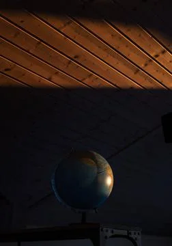 Globe illuminated by the sun Stock Photos