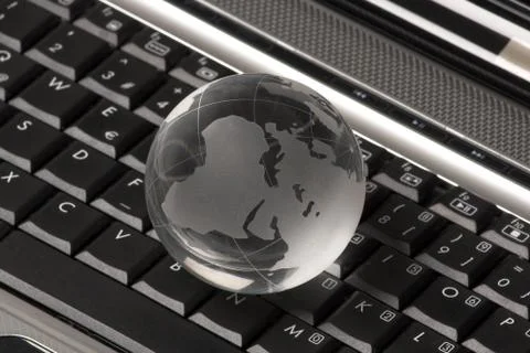 Globe on laptop Stock Photos