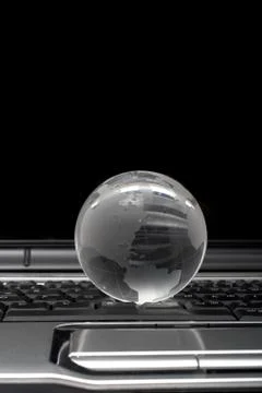Globe on laptop Stock Photos