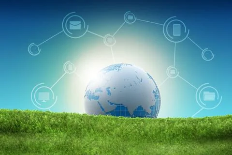 Globe lying on the green grass Illustrazione stock
