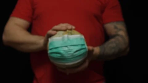 Globe on man hands isolated on black background 動画素材 128623567