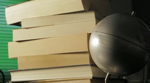 Globe map turning with a stack of books on background Stock Footage 54595692