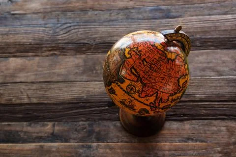 Globe map on wooden table Stock Photos