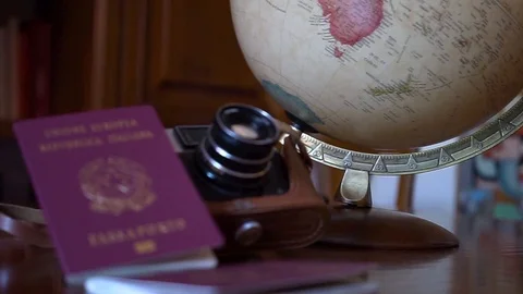 Globe map of the world passport and old vintage camera composition Stock Footage 90021744