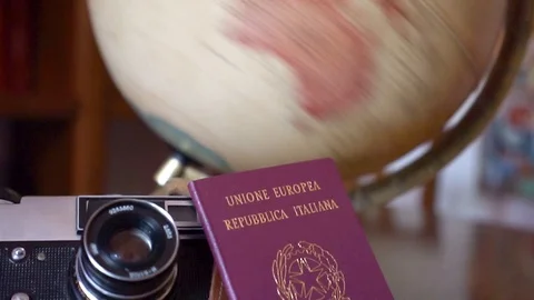 Globe map of the world passport and old vintage camera composition Stock Footage 90021779