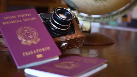 Globe map of the world passport and old vintage camera composition Stock Footage 90021787