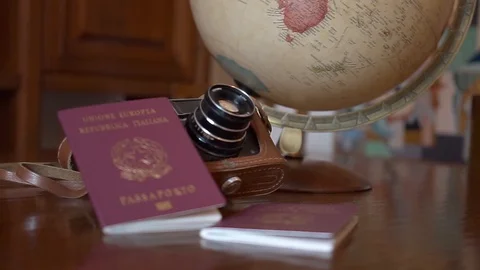 Globe map of the world passport and old vintage camera composition Stock Footage 90022129