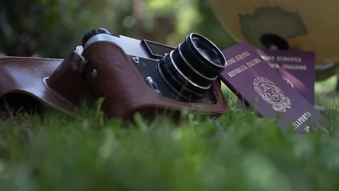 Globe map of the world passport and old vintage camera composition Stock Footage 90022165