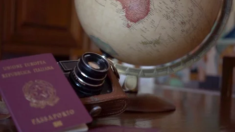 Globe map of the world passport and old vintage camera composition Stock Footage 90022985