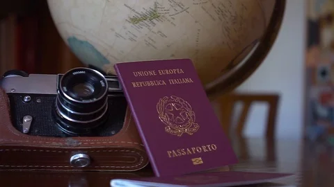Globe map of the world passport and old vintage camera composition Stock Footage 90023357
