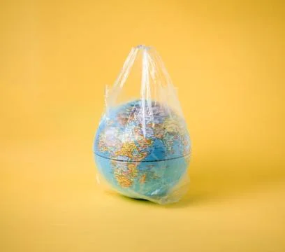 Globe model in plastic bag, save the world environment Foto stock