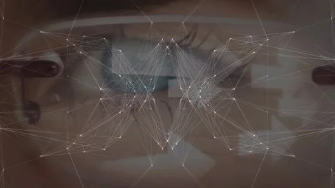 Globe of network of connections against close up of a female eye wearing glasses Video stock 327444253