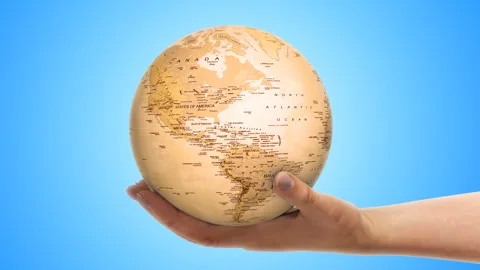 Globe With Old Map On a Hand Stock Footage 249614270