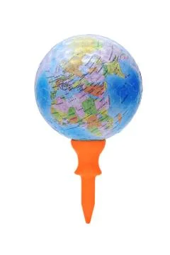 Globe on orange golf tee Foto stock
