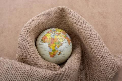 Globe placed on canvas background Stock Photos