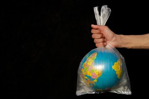 Globe in a plastic bag. Concept of plastic pollution of the earth. Foto stock