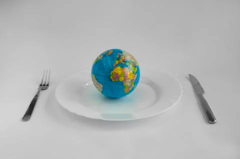 Globe in a plate Stock Photos