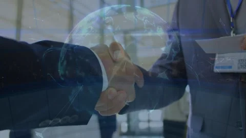 Globe of plexus networks over mid section of two businessmen shaking hands at Stock Footage 328518194