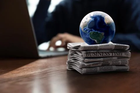 The globe puts on pile of newspaper in front of businessman. Foto stock