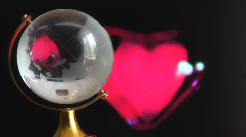 Globe on red beating heart Stock Footage 39540229