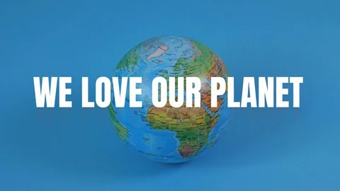 Globe rotates on the blue background. We love your planet text. Video stock 129896285
